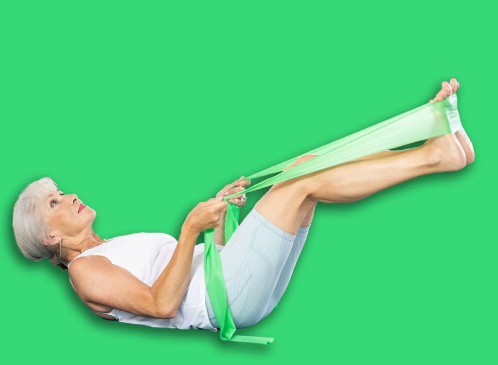 mature woman supine leg press exercise 2495743095.jpg