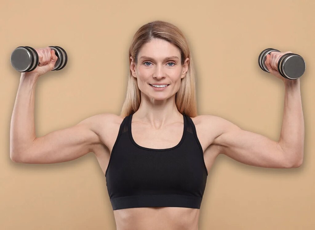 mature woman dumbbell exercise 2250481973.jpg
