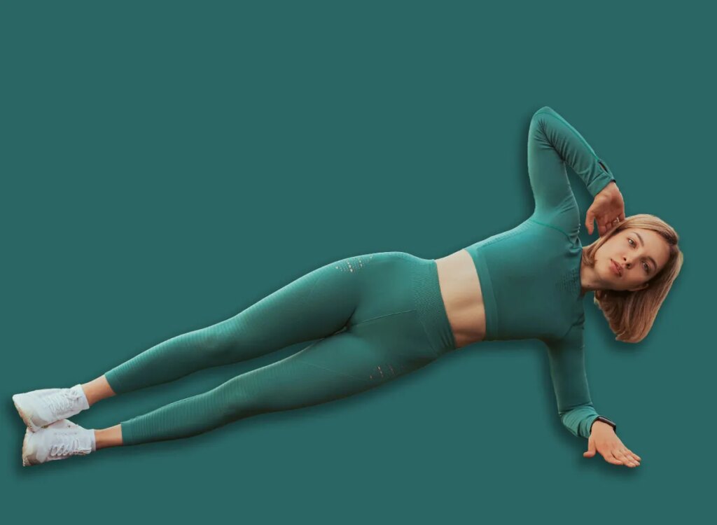 5 Morning Core Workout routines for Other folks Over 55, According to a Instructor woman side plank exercise 2041739864.jpg
