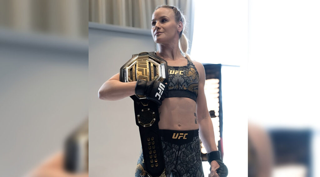 female ufc fighter valentina shevchenko holding the championship belt .jpg