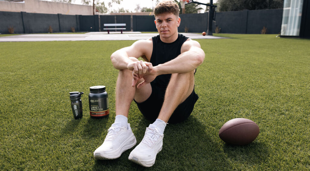 football player cooper dejean on the field next to supplements.jpg