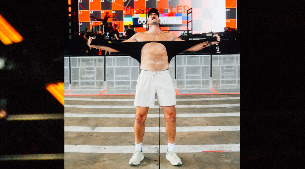 russell dickerson ripping his shirt.jpg