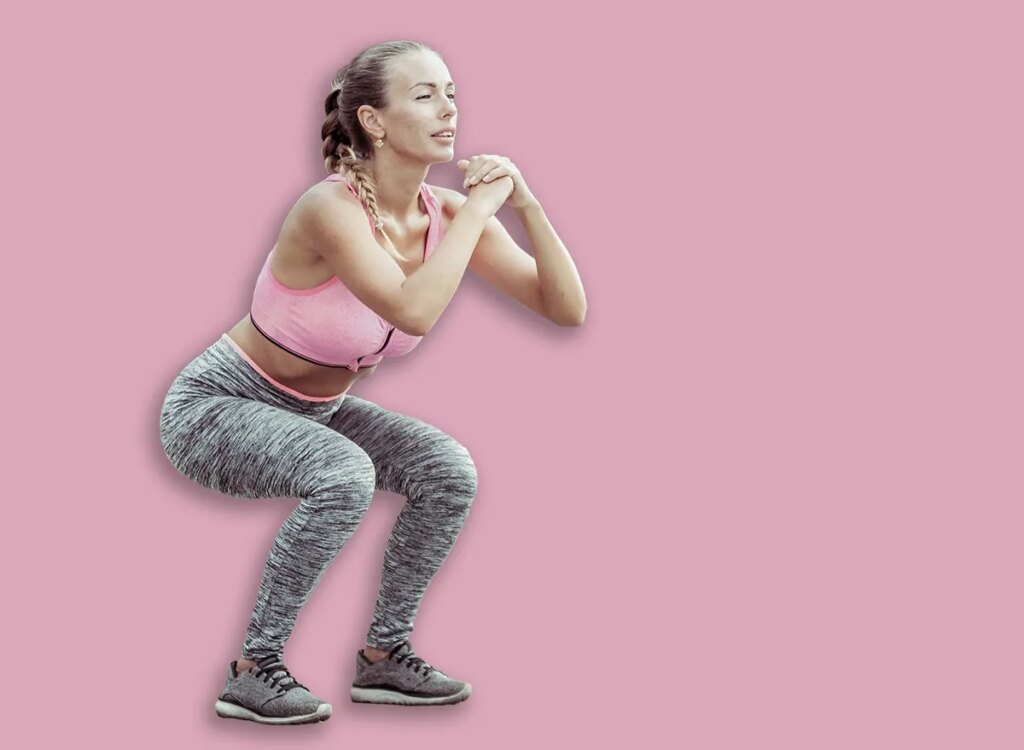 woman squat exercise 2279573649.jpg