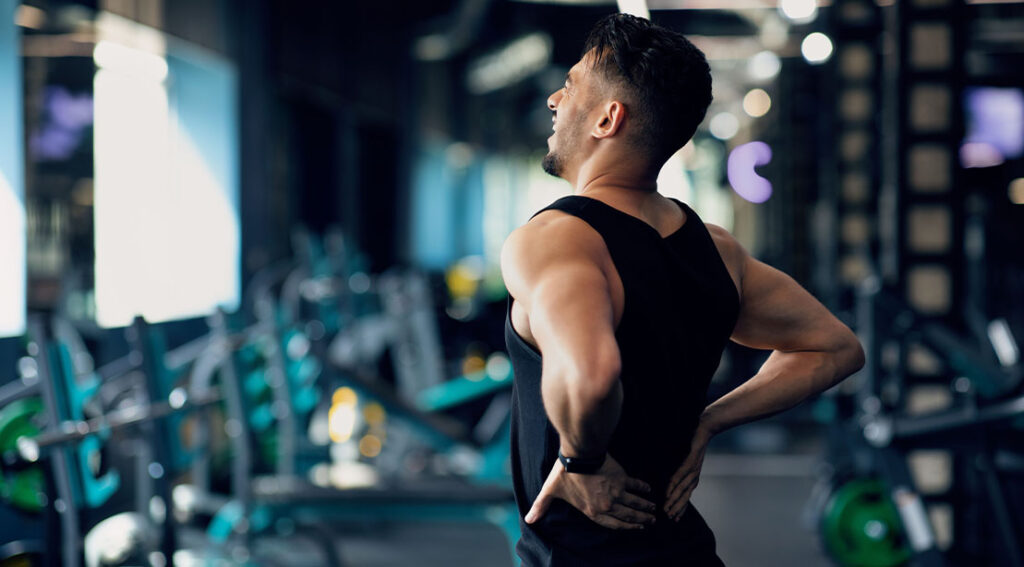 young and athletic male lacking thoracic spine mobility suffering from lower back pain.jpg