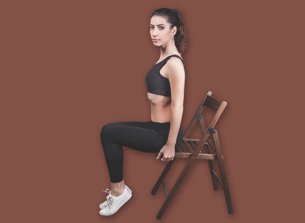 fit woman sitting on a chair 400523584.jpg