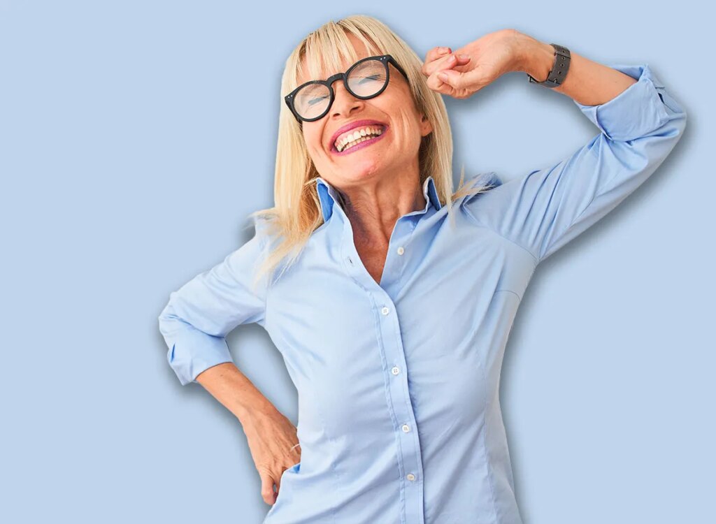 5 Chair Workouts To Repair Backbone Power After 60 happy mature woman stretching back 1579069501.jpg