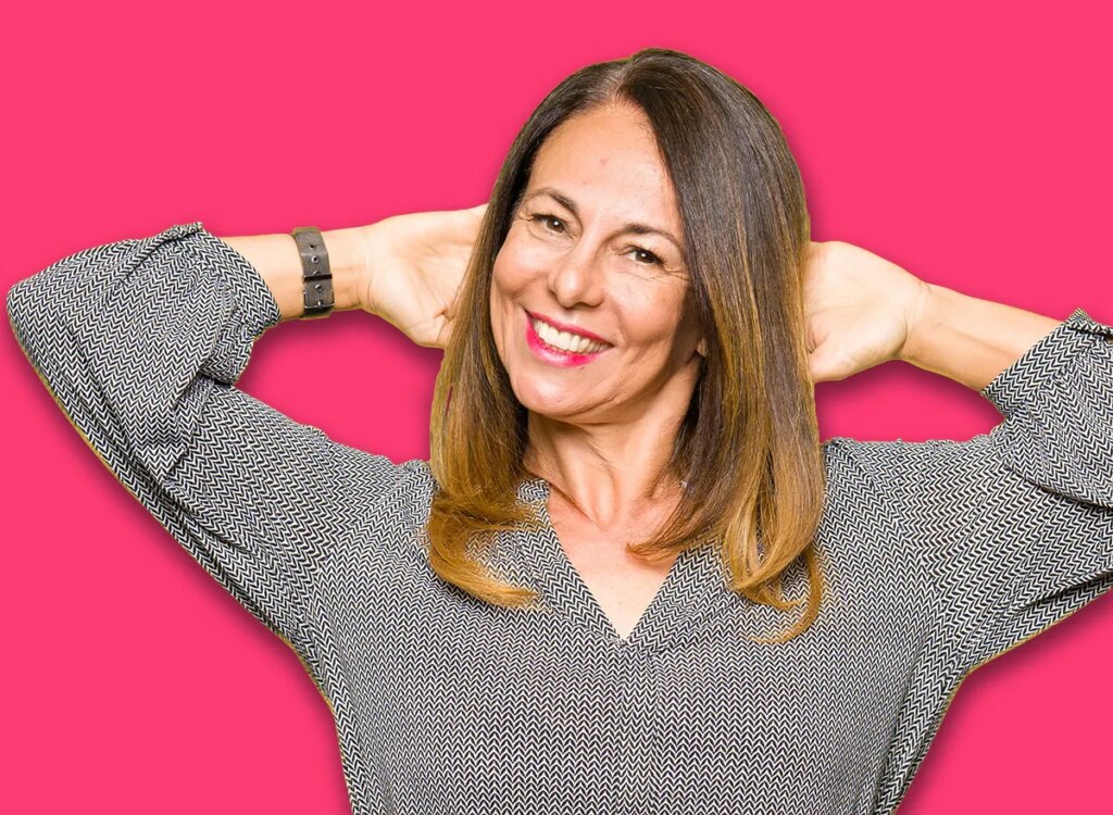 happy middle aged woman hands behind head 1360170653.jpg