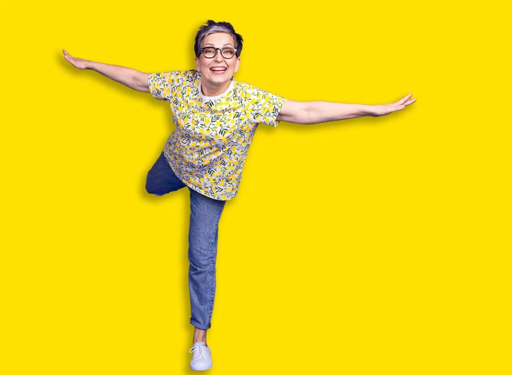 mature woman balancing exercise 2596461149.jpg
