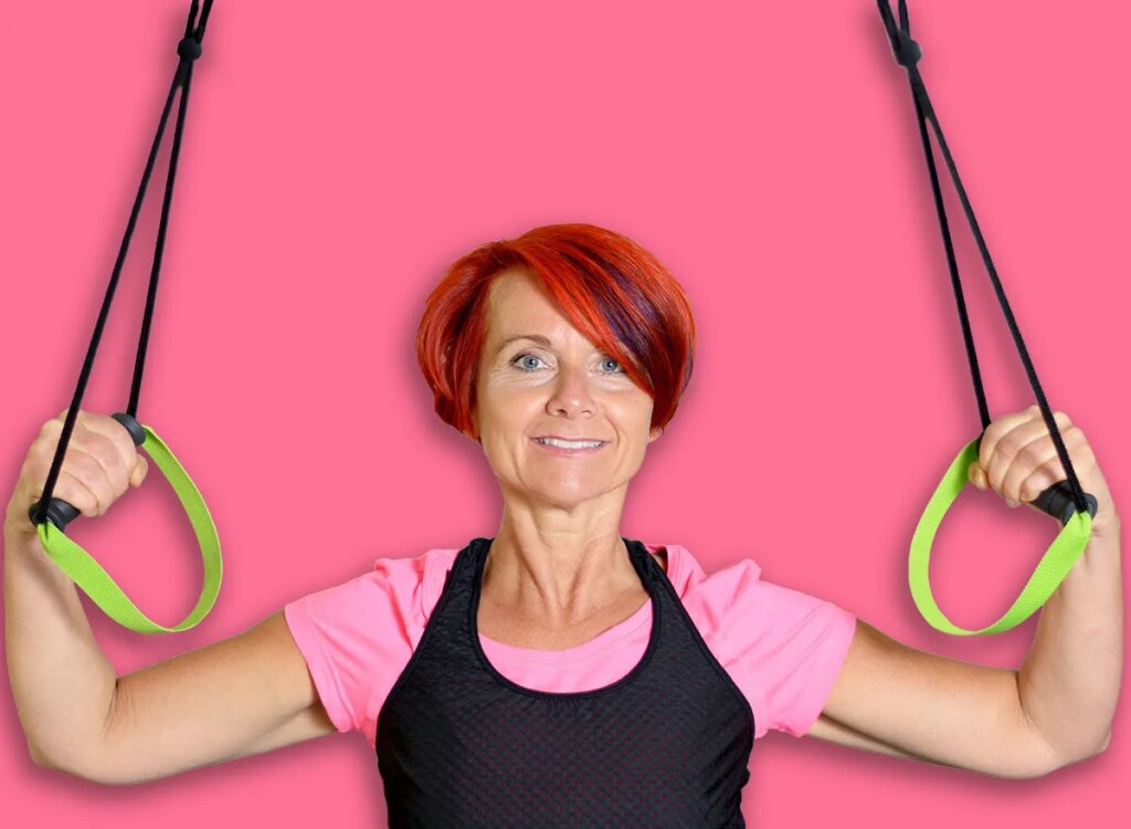 mature woman overhead band pull downs exercise 297754304.jpg