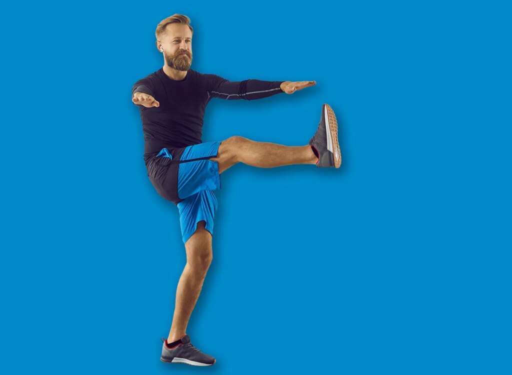 middle aged man leg swings exercise 2137656171.jpg