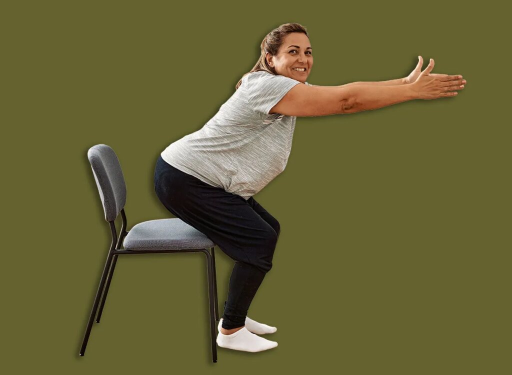 middle aged woman chair sit to stand squats exercise 2060317373.jpg