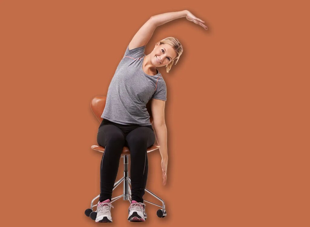 woman seated side bends chair exercise 2400995151.jpg