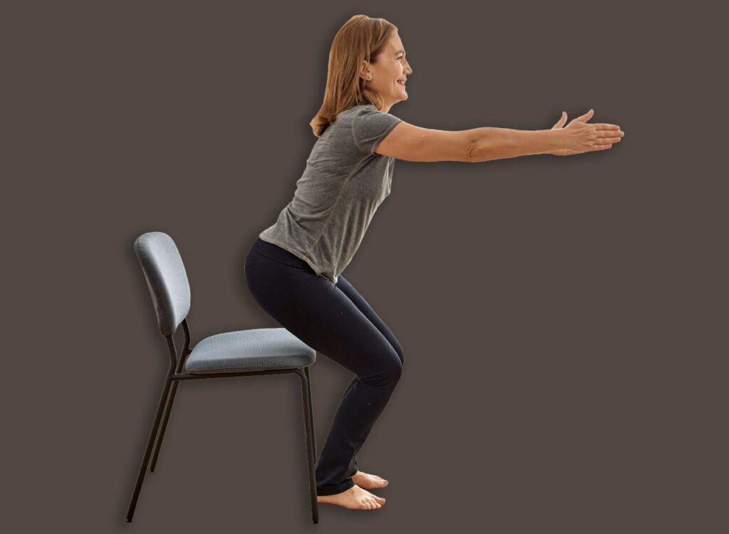 5 Chair Workout routines That Repair Leg Power After 60 woman chair squat exercise 2165165081.jpg