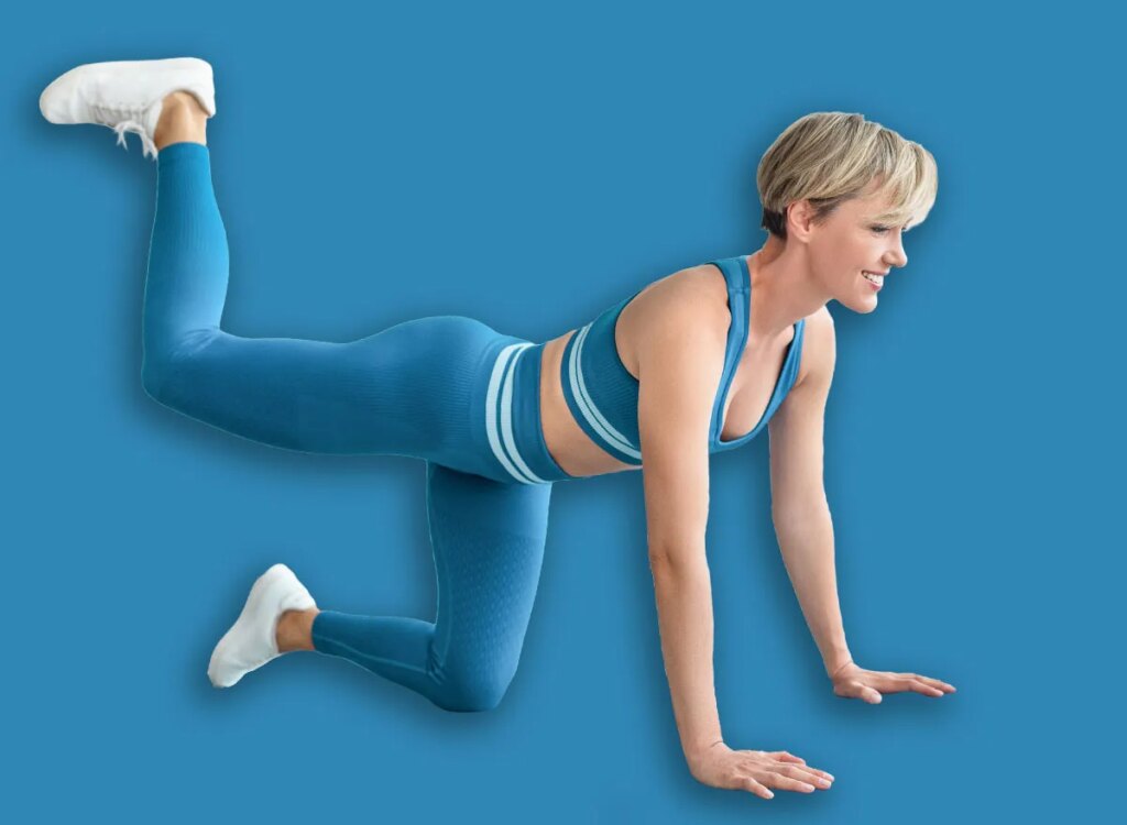 woman donkey kicks exercise 2055419699.jpg