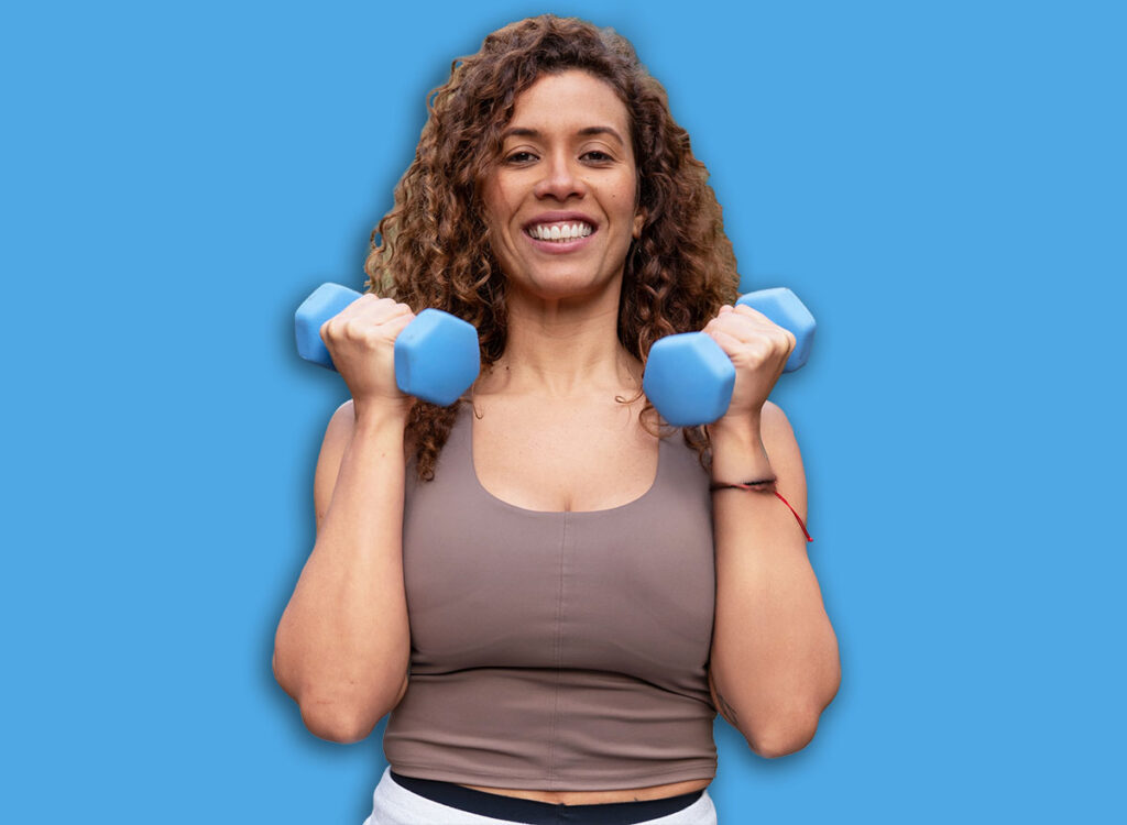 woman dumbbell curls exercise 2749444523.jpg
