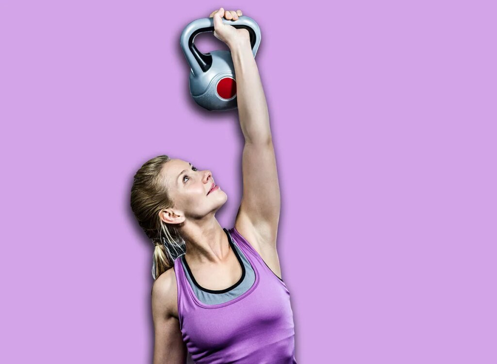 woman waiters kettlebell walk exercise 369438071.jpg
