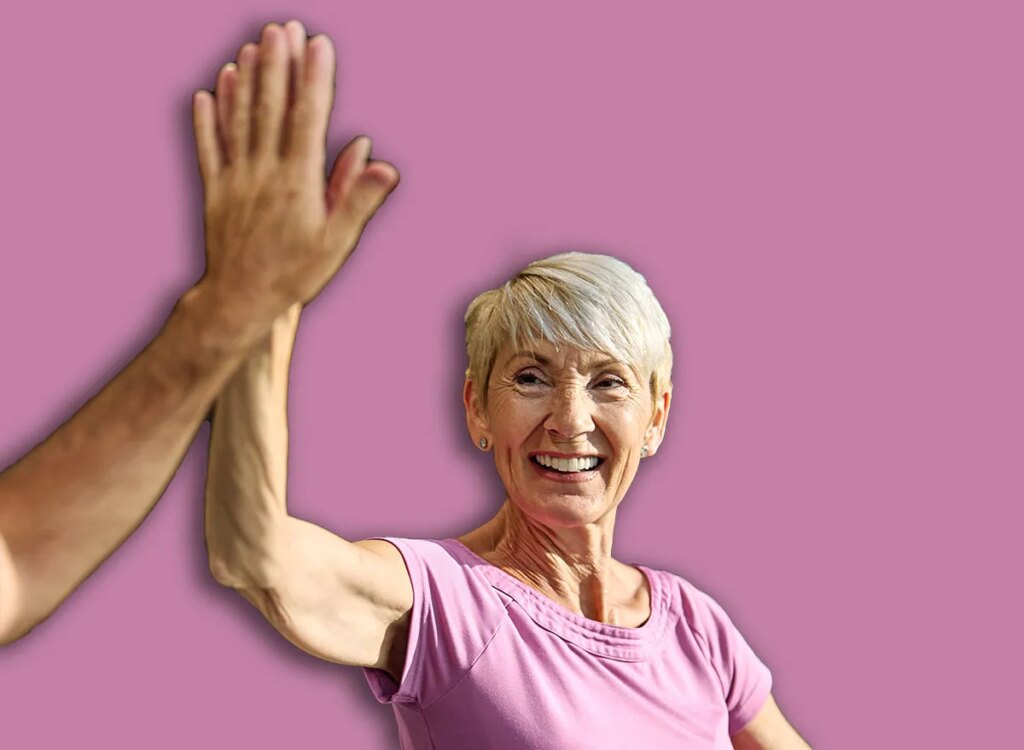 5 Chair Workouts To Repair Glute Power After 60 fit mature woman high five 2377584859.jpg