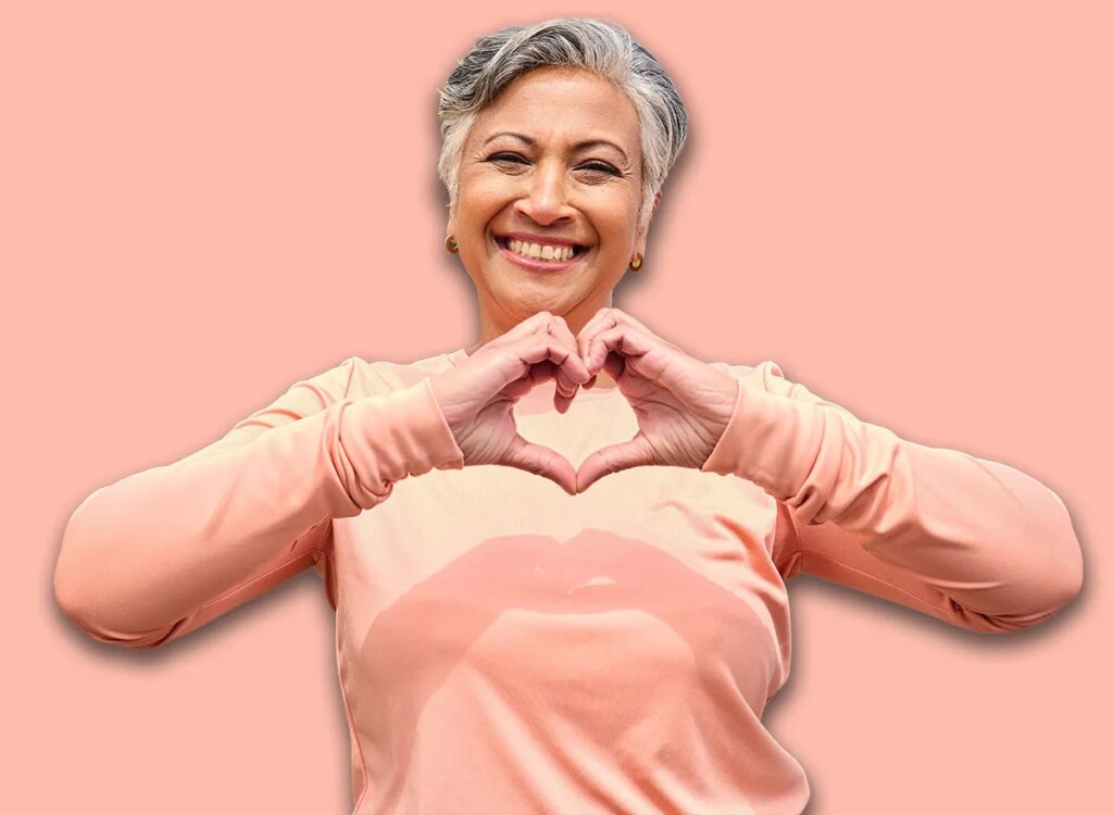 Status Stomach Workouts After 60: 5 Strikes happy woman holding heart shape hands 2385072921.jpg