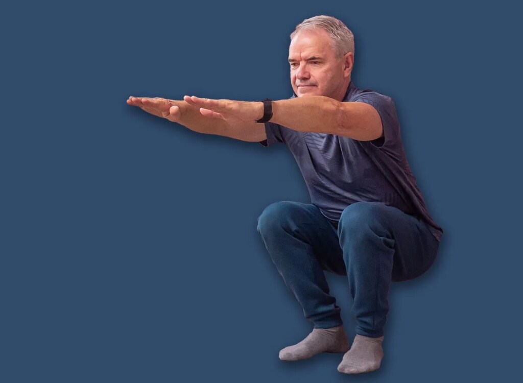 mature man squats exercise 2698437077.jpg