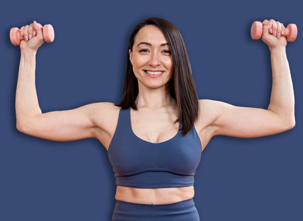 Shoulder Workouts After 60: 4 Mild Strikes woman dumbbell press exercise 2724509167.jpg